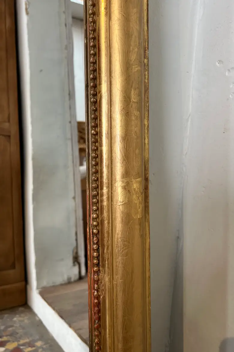 Ancien miroir doré avec noeud