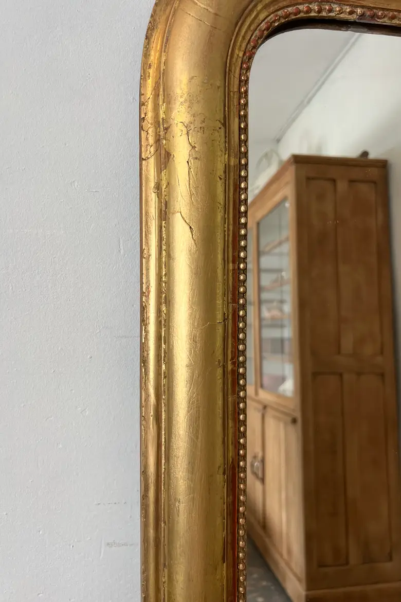 Ancien miroir doré avec noeud
